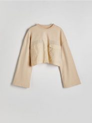 Krótka bluza z łączonych materiałów - beżowy. Brązowe bluzy damskie Reserved, l, bez wzorów, z bawełny, bez ramiączek, bez kaptura. W wyprzedaży za 29.99 zł.