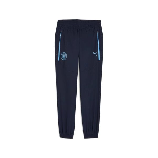 Spodnie dresowe Manchester City Woven 2025/26. Niebieskie spodnie sportowe męskie Puma, bez wzorów, z dresówki, do piłki nożnej. Za 334.50 zł.