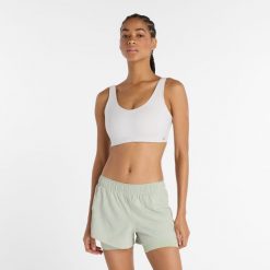 Biustonosz New Balance WB51052GYM – biały. Białe biustonosze New Balance, bez wzorów, z lycry. Za 389.99 zł.