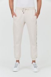 GUESS Beżowe spodnie Mickey Cuff Pant. Brązowe spodnie sportowe męskie Guess, l, z aplikacjami, z dresówki. W wyprzedaży za 322.99 zł.