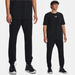 Spodnie Męskie Under Armour Treningowe Sportowe. Czarne buty sportowe męskie Under Armour, bez wzorów, bez zapięcia, na fitness i siłownię. Za 299.99 zł.