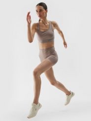 4F Legginsy krótkie treningowe z materiału z recyklingu damskie - beżowe XXL. Brązowe legginsy damskie 4F, bez wzorów, z dzianiny. W wyprzedaży za 39.99 zł.