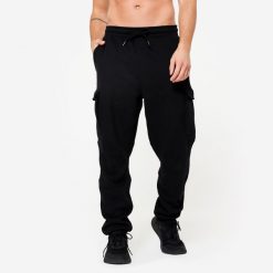 Spodnie dresowe męskie Domyos Gym & Pilates. Czarne spodnie sportowe męskie DOMYOS, l, bez wzorów, z bawełny, na fitness i siłownię. Za 129.99 zł.