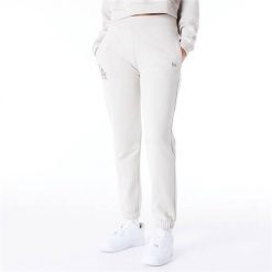Spodnie sportowe damskie New Era 60435304. Białe spodnie dresowe damskie New Era, bez wzorów, z dresówki, sportowe. Za 532.00 zł.