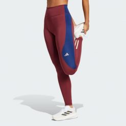 Legginsy Own The Run Colorblock Full-Length. Czerwone bielizna sportowa damska Adidas, bez wzorów, z materiału. W wyprzedaży za 216.75 zł.