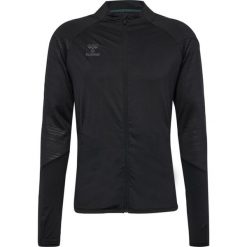 Kurtka z dresu Hummel Pro. Czarne kurtki sportowe damskie Hummel, bez wzorów, z dresówki, bez ramiączek, bez kaptura. Za 273.80 zł.