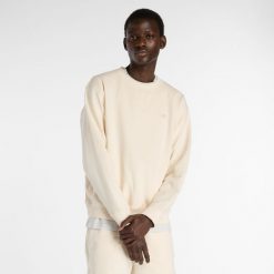 Bluza męska New Balance MT41506PEF – beżowa. Brązowe bluzy męskie New Balance, m, z aplikacjami, z bawełny, klasyczne, bez ramiączek, bez kaptura. Za 359.99 zł.