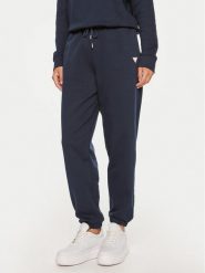 Guess Jeans Spodnie dresowe W4YB33 KC811 Granatowy Regular Fit. Niebieskie spodnie dresowe damskie Guess Jeans, z aplikacjami, z bawełny. Za 199.99 zł.
