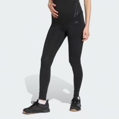 Legginsy Optime Essentials Full-Length (Maternity). Czarne legginsy damskie Adidas, bez wzorów, z materiału. Za 219.00 zł.