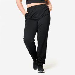 Spodnie fitness damskie Domyos. Czarne spodnie dresowe damskie DOMYOS, bez wzorów, z dresówki, sportowe. Za 49.99 zł.