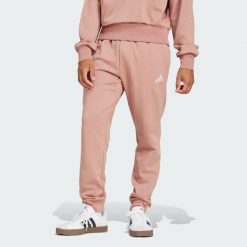 Spodnie polarowe Essentials Feelcozy. Białe buty sportowe męskie Adidas, bez wzorów, z polaru, bez zapięcia, na fitness i siłownię. W wyprzedaży za 173.35 zł.