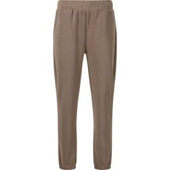Damskie spodnie dresowe Athlecia Jillnana V2. Brązowe spodnie dresowe damskie Athlecia, bez wzorów, z dresówki, sportowe, na fitness i siłownię. Za 253.00 zł.