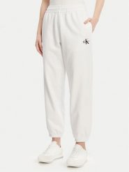 Calvin Klein Jeans Spodnie dresowe Monologo LV047B235G Biały Regular Fit. Białe spodnie sportowe damskie Calvin Klein Jeans, bez wzorów, z bawełny. Za 239.99 zł.
