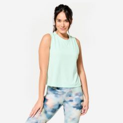 Koszulka bez rękawów damska Domyos Gym & Pilates Crop Top. Niebieskie koszulki sportowe damskie DOMYOS, l, bez wzorów, z bawełny, bez ramiączek, na fitness i siłownię. W wyprzedaży za 39.99 zł.