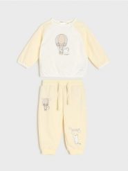 Bawełniany komplet: bluza i spodnie Moomin - kremowy. Białe bluzy damskie Sinsay, l, bez wzorów, z bawełny, sportowe, bez ramiączek, bez kaptura. Za 25.99 zł.