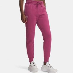 Spodnie Damskie Dresowe Joggery Under Armour Rival Fleece. Fioletowe spodnie dresowe damskie Under Armour, bez wzorów, z dresówki, sportowe, na fitness i siłownię. W wyprzedaży za 129.89 zł.