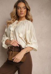 Beżowa Wiskozowa Koszula Zdobiona Wiązaniem i Aplikacjami z Kwiatami Belinea. Brązowe koszule damskie Renee, z aplikacjami, z jeansu, eleganckie, bez kołnierzyka, bez ramiączek. Za 64.99 zł.