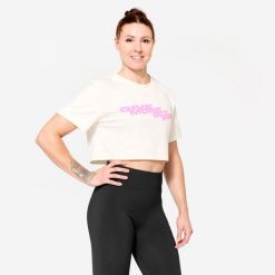 Koszulka fitness damska Domyos crop top. Białe bluzki damskie DOMYOS, s, bez wzorów, z bawełny, sportowe, bez kołnierzyka, bez ramiączek. W wyprzedaży za 39.99 zł.