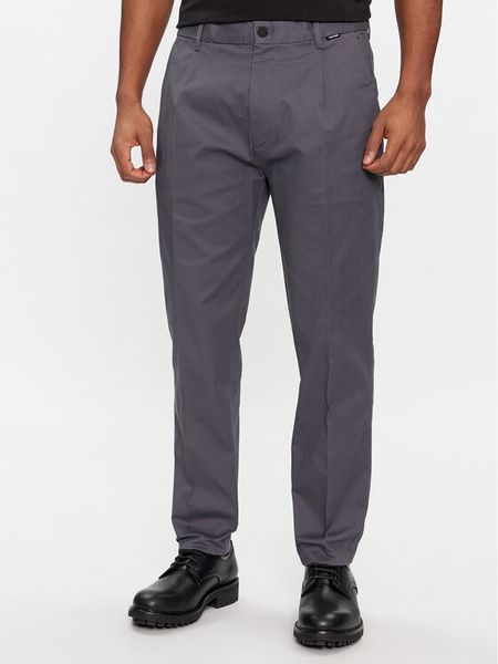 Calvin Klein Spodnie garniturowe Modern Twill Tapered Pleat K10K111490 Szary Slim Fit. Szare eleganckie spodnie męskie Calvin Klein, bez wzorów, z bawełny. Za 319.99 zł.
