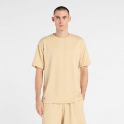 Koszulka męska New Balance MT6100FRABC – żółta. Żółte koszulki sportowe męskie New Balance, m, bez wzorów, z materiału, bez ramiączek. Za 149.99 zł.