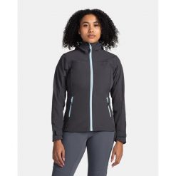 Damska kurtka softshell Kilpi RAVIA-W. Niebieskie kurtki sportowe damskie Kilpi, xs, bez wzorów, z softshellu, bez ramiączek, bez kaptura, trekkingowe. Za 318.77 zł.
