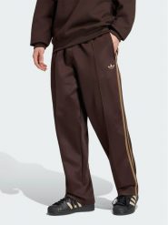 Adidas Spodnie dresowe adicolor Spacer KS7432 Brązowy ciemny Baggy Fit. Brązowe spodnie sportowe męskie Adidas, l, bez wzorów, z bawełny, trekkingowe. Za 348.99 zł.