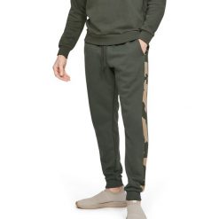 Under Armour Rival Spodnie dresowe Zielony. Zielone spodnie sportowe męskie Under Armour, s, bez wzorów, z bawełny. Za 274.95 zł.