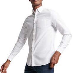 Koszula z długim rękawem z bawełny organicznej Superdry Oxford. Białe koszule męskie Superdry, xl, bez wzorów, z bawełny, casualowe, bez kołnierzyka, bez ramiączek. Za 258.65 zł.
