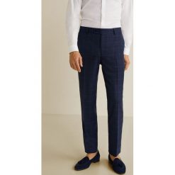 Mango Man - Spodnie Brasilia. Niebieskie spodnie materiałowe męskie Mango Man, bez wzorów, z bawełny. W wyprzedaży za 79.90 zł.