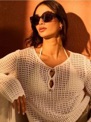 Ażurowy sweter z bawełny - kremowy. Białe swetry nierozpinane damskie Sinsay, l, w ażurowe wzory, z bawełny, bez kołnierzyka, bez ramiączek. Za 49.99 zł.