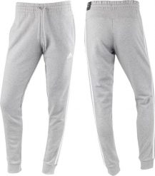 Adidas Spodnie damskie adidas Essentials 3-Stripes French Terry Cuffed szare IC9922 L. Szare spodnie dresowe damskie Adidas, bez wzorów, sportowe. Za 184.95 zł.