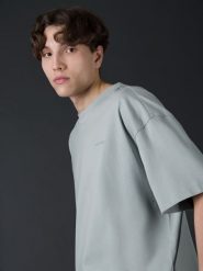 4F T-shirt oversize z bawełny organicznej męski 4F x Robert Lewandowski L. Niebieskie t-shirty męskie 4F, l, bez wzorów, z bawełny, bez kołnierzyka, bez ramiączek. W wyprzedaży za 79.99 zł.