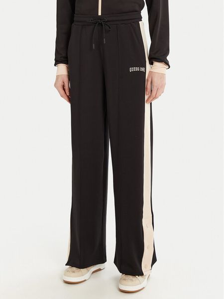 Guess Spodnie dresowe V5RB00 KCO72 Brązowy Regular Fit. Brązowe spodnie dresowe damskie Guess, z aplikacjami, z dresówki. Za 219.99 zł.