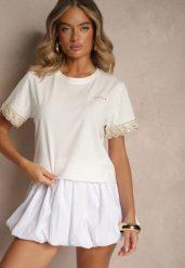 Biały Bawełniany T-shirt z Koronkowymi Zdobieniami i Cekinami Drane. Białe t-shirty damskie Renee, m, z aplikacjami, z bawełny, eleganckie, bez kołnierzyka, bez ramiączek. Za 44.99 zł.