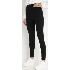 Czarne Legginsy Eryssan. Czarne legginsy damskie Born2be, bez wzorów, z bawełny. Za 19.99 zł.