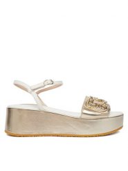 Liu Jo Sandały Flo 01 SA6137 PX026 Złoty. Żółte sandały damskie Liu Jo, bez wzorów, ze skóry, bez obcasa, na koturnie, bez zapięcia. Za 599.99 zł.