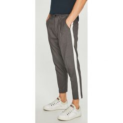 Jack & Jones - Spodnie. Szare eleganckie spodnie męskie Jack & Jones, bez wzorów, z elastanu. W wyprzedaży za 99.90 zł.