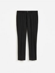 Garniturowe spodnie slim fit - czarny. Czarne garnitury męskie Reserved, l, bez wzorów, z tkaniny. Za 169.99 zł.