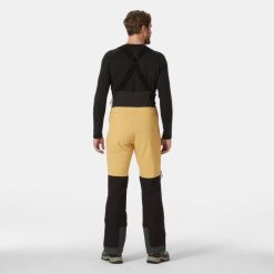 Spodnie narciarskie z szelkami Helly Hansen Odin BC Softshell. Brązowe spodnie sportowe męskie Helly Hansen, m, bez wzorów, z softshellu, narciarskie. Za 1,535.50 zł.