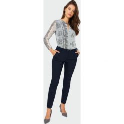 Eleganckie spodnie o klasycznym kroju. Szorty damskie Greenpoint, bez wzorów, z bawełny, eleganckie. Za 149.99 zł.