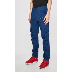 G-Star Raw - Spodnie. Niebieskie spodnie materiałowe męskie G-Star Raw, bez wzorów, z bawełny. W wyprzedaży za 269.90 zł.