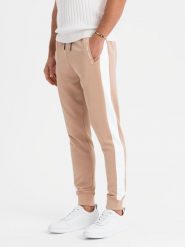 Męskie dresowe spodnie joggery z kontrastowymi lampasami – beżowe V4 OM-PASK-0229 - XXL. Brązowe spodnie sportowe męskie Ombre Clothing, l, z aplikacjami, z dresówki. Za 131.99 zł.