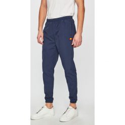 Ellesse - Spodnie. Niebieskie spodnie materiałowe męskie Ellesse, bez wzorów, z materiału. W wyprzedaży za 169.90 zł.
