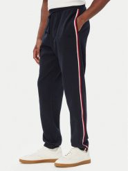 Tommy Hilfiger Spodnie dresowe UM0UM03944 Granatowy Regular Fit. Niebieskie spodnie sportowe męskie Tommy Hilfiger, l, bez wzorów, z bawełny. Za 369.99 zł.