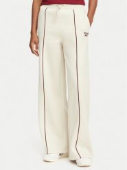 Reebok Spodnie dresowe Oliwia RK25683CCW Beżowy Regular Fit. Brązowe spodnie dresowe damskie Reebok, bez wzorów, z dresówki. Za 199.99 zł.