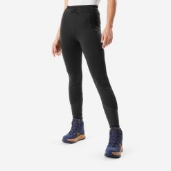 Legginsy turystyczne damskie Quechua NH500 Warm. Czarne legginsy damskie QUECHUA, bez wzorów, z materiału. Za 199.99 zł.
