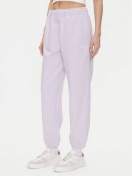 Calvin Klein Jeans Spodnie dresowe Monologo LV047B235G Fioletowy Regular Fit. Fioletowe spodnie dresowe damskie Calvin Klein Jeans, bez wzorów, z bawełny. Za 239.99 zł.