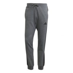 Spodnie do biegania adidas Essentials 3-Stripes Fleece. Szare spodnie sportowe męskie Adidas, bez wzorów, do biegania. Za 303.50 zł.