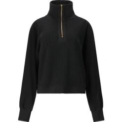 Damski sweter 1/2 zip Athlecia Reiley. Czarne swetry nierozpinane damskie Athlecia, l, bez wzorów, z materiału, eleganckie, bez kołnierzyka, bez ramiączek. Za 288.00 zł.