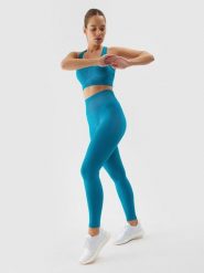 4F Legginsy treningowe bezszwowe damskie - turkusowe XS/S. Niebieskie legginsy damskie 4F, l, bez wzorów, z dzianiny, z podwyższonym stanem, długie, na fitness i siłownię. W wyprzedaży za 59.99 zł.